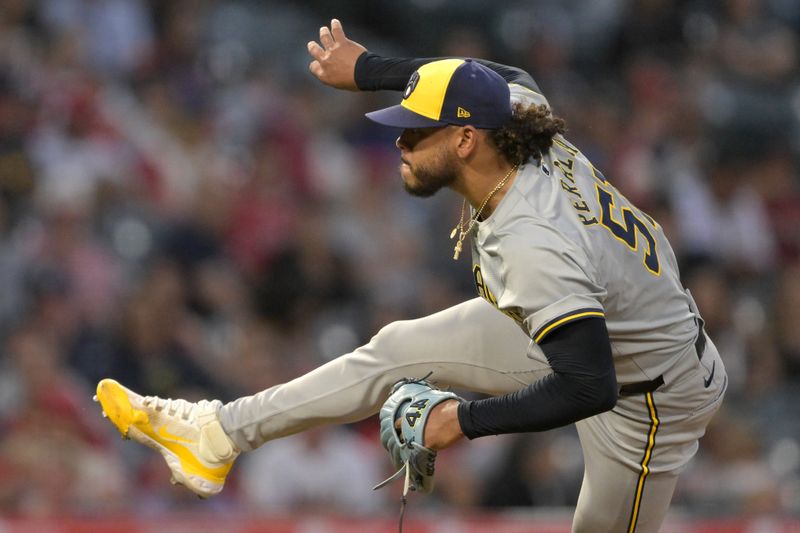 Jun 19, 2024; Anaheim, California, USA;  Milwaukee Brewers starting pitcher Freddy Peralta (51) delivers to the plate in the sixth inning against the Los Angeles Angels at Angel Stadium. Mandatory Credit: Jayne Kamin-Oncea-USA TODAY Sports