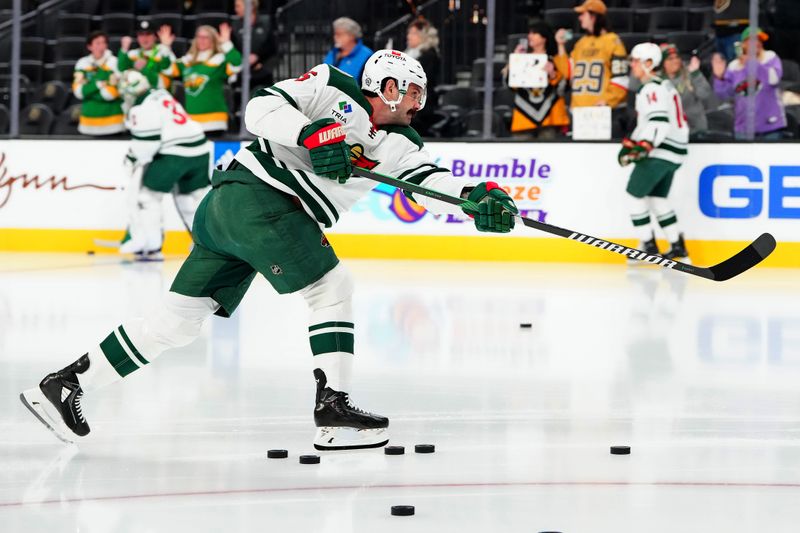 Feb 12, 2024; Las Vegas, Nevada, USA; Minnesota Wild defenseman Jake Middleton (5) warms up before a game against the Vegas Golden Knights at T-Mobile Arena. Mandatory Credit: Stephen R. Sylvanie-USA TODAY Sports