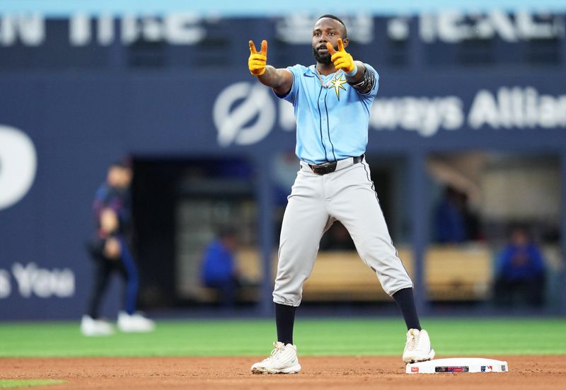 Jul 24, 2024; Toronto, Ontario, CAN; Tampa Bay Rays left fielder Randy Arozarena (56) celebrates after hitting a double against the Toronto Blue Jays during the fifth inning at Rogers Centre. Mandatory Credit: Nick Turchiaro-USA TODAY Sports