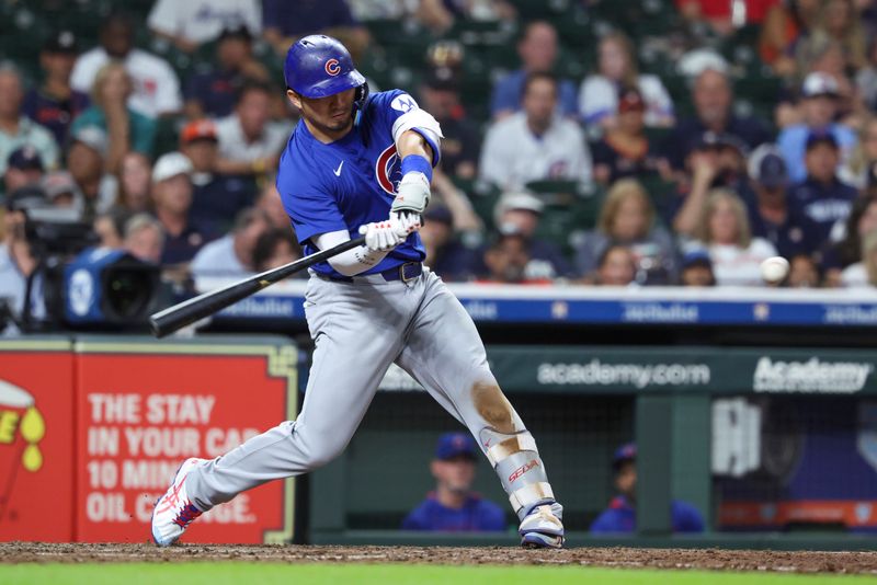 Jun 28, 2025; Houston, Texas, USA; Chicago Cubs designated hitter Seiya Suzuki (27) hits a home run during the eighth inning against the Houston Astros at Daikin Park. Mandatory Credit: Troy Taormina-Imagn Images