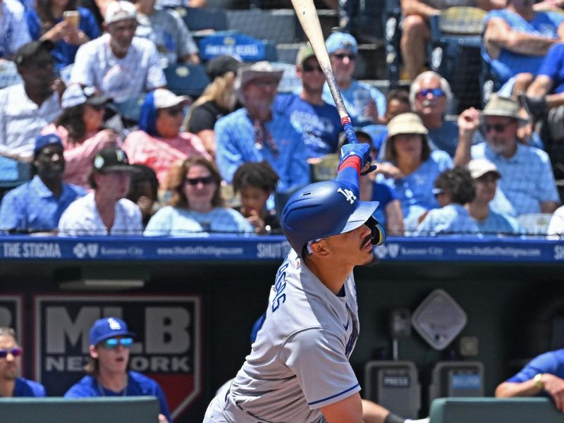 Jul 2, 2023; Kansas City, Missouri, USA;  Los Angeles Dodgers second baseman Miguel Vargas (17) hits a RBI sacrifice fly in the fourth inning against the Kansas City Royals at Kauffman Stadium. Mandatory Credit: Peter Aiken-USA TODAY Sports