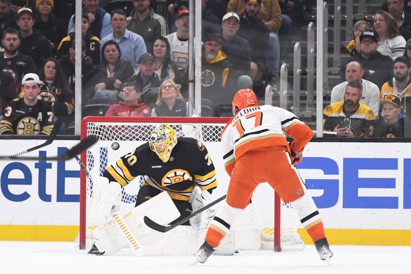Oct 23, 2025; Boston, Massachusetts, USA; Boston Bruins goaltender Joonas Korpisalo (70) makes a save on Anaheim Ducks left wing Alex Killorn (17) during the first period at TD Garden. Mandatory Credit: Bob DeChiara-Imagn Images