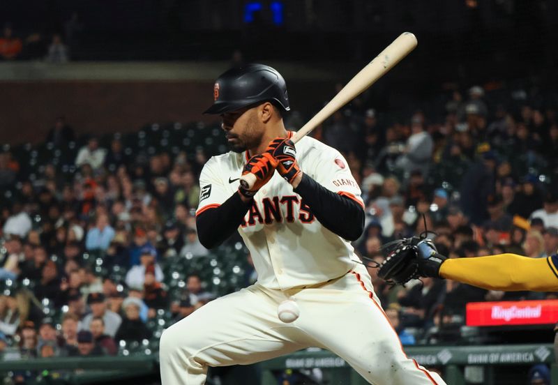 Sep 12, 2024; San Francisco, California, USA; San Francisco Giants first baseman LaMonte Wade Jr. (31) earns a walk against the Milwaukee Brewers during the fourth inning at Oracle Park. Mandatory Credit: Kelley L Cox-Imagn Images