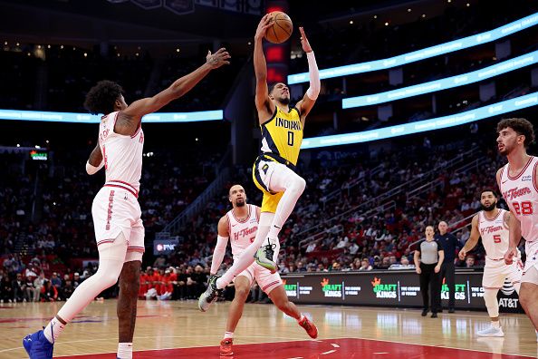 HOUSTON, TEXAS - DECEMBER 26: Tyrese Haliburton #0 of the Indiana Pacers drives to the basket in the first half against the Houston Rockets at Toyota Center on December 26, 2023 in Houston, Texas.  NOTE TO USER: User expressly acknowledges and agrees that, by downloading and or using this photograph, User is consenting to the terms and conditions of the Getty Images License Agreement. (Photo by Tim Warner/Getty Images)