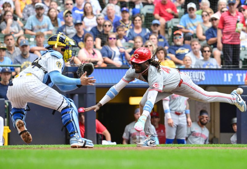 Jun 16, 2024; Milwaukee, Wisconsin, USA; Cincinnati Reds shortstop Elly De La Cruz (44) scores after an error as Milwaukee Brewers catcher William Contreras (24) waits for the ball in the third inning at American Family Field. Mandatory Credit: Benny Sieu-USA TODAY Sports