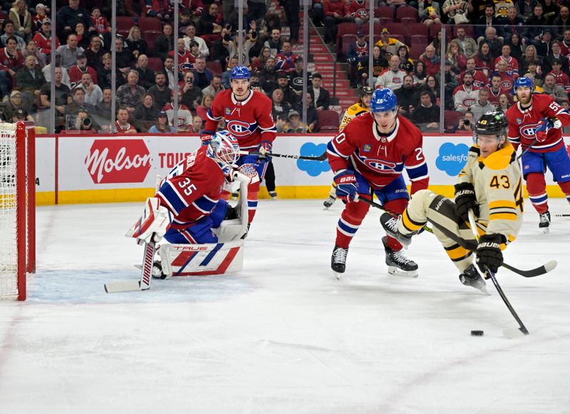 Mar 14, 2024; Montreal, Quebec, CAN; Boston Bruins forward Danton Heinen (43) scores a goal against Montreal Canadiens goalie Sam Montembeault (35) during the first period at the Bell Centre. Mandatory Credit: Eric Bolte-USA TODAY Sports