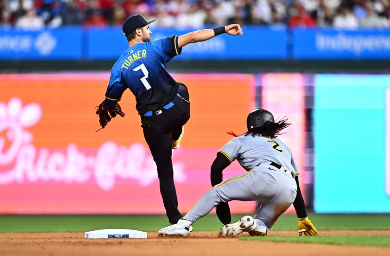 Apr 12, 2024; Philadelphia, Pennsylvania, USA; Philadelphia Phillies shortstop Trea Turner (7) attempts to turn a double play over Pittsburgh Pirates first baseman Connor Joe (2) in the seventh inning at Citizens Bank Park. Mandatory Credit: Kyle Ross-USA TODAY Sports