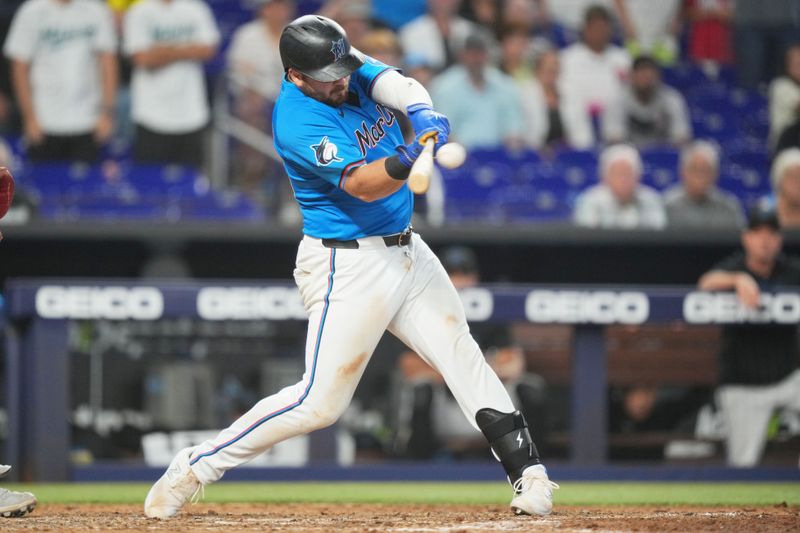 Jul 7, 2024; Miami, Florida, USA;  Miami Marlins third baseman Jake Burger (36) hits a three-run walk-off home run in the ninth inning against the Chicago White Sox at loanDepot Park. Mandatory Credit: Jim Rassol-USA TODAY Sports