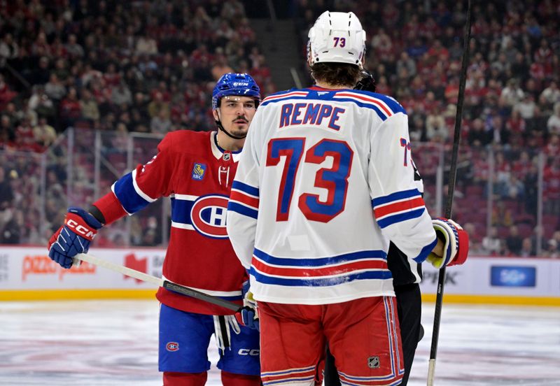 Oct 18, 2025; Montreal, Quebec, CAN; Montreal Canadiens defenseman Arber Xhekaj (72) and New York Rangers forward Matt Rempe (73) trade words during the third period at the Bell Centre. Mandatory Credit: Eric Bolte-Imagn Images