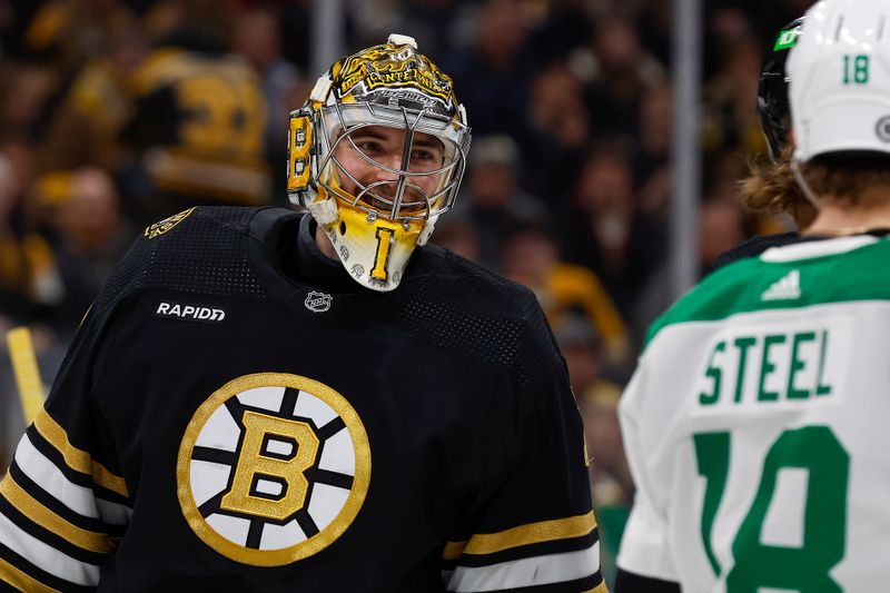 Feb 19, 2024; Boston, Massachusetts, USA; Boston Bruins goaltender Jeremy Swayman (1) smiles at Dallas Stars center Sam Steel (18) during the second period at TD Garden. Mandatory Credit: Winslow Townson-USA TODAY Sports