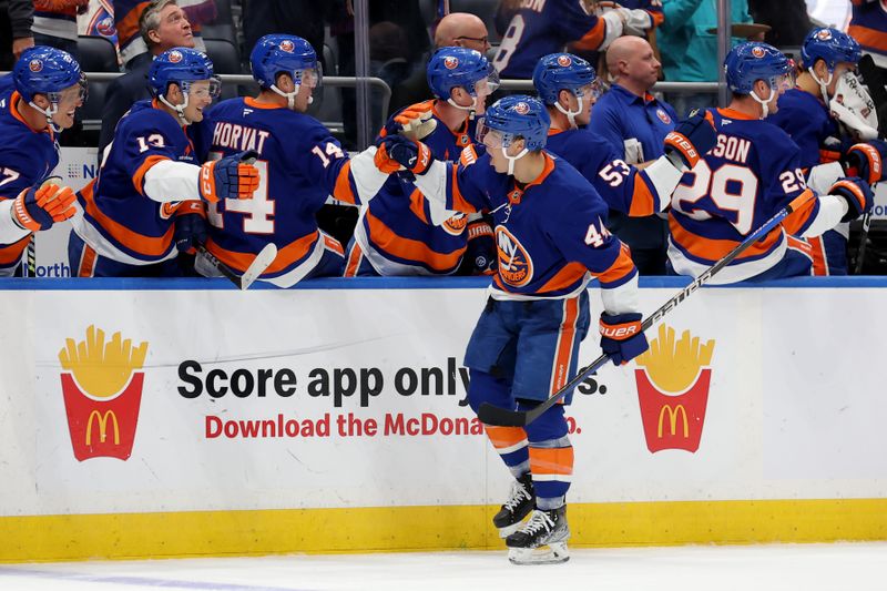 Oct 10, 2024; Elmont, New York, USA; New York Islanders center Jean-Gabriel Pageau (44) celebrates his goal against the Utah Hockey Club with teammates during the third period at UBS Arena. Mandatory Credit: Brad Penner-Imagn Images