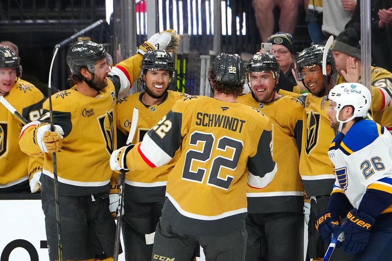 Oct 11, 2024; Las Vegas, Nevada, USA; Vegas Golden Knights defenseman Shea Theodore (27) celebrates with team mates after scoring a goal against the St. Louis Blues during the second period at T-Mobile Arena. Mandatory Credit: Stephen R. Sylvanie-Imagn Images