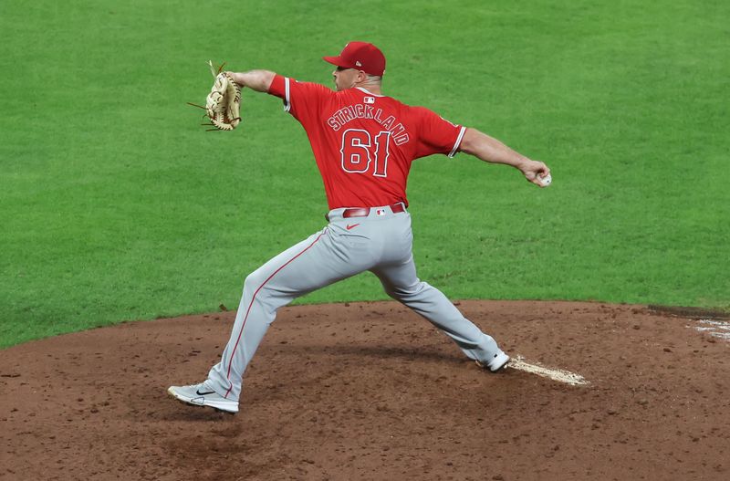 Sep 19, 2024; Houston, Texas, USA; Los Angeles Angels relief pitcher Hunter Strickland (61) pitches against the Houston Astros in the seventh inning at Minute Maid Park. Mandatory Credit: Thomas Shea-Imagn Images