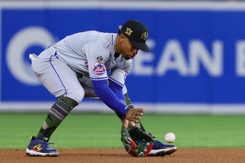 May 17, 2024; Miami, Florida, USA; New York Mets shortstop Francisco Lindor (12) catches a ground ball against the Miami Marlins during the first inning at loanDepot Park. Mandatory Credit: Sam Navarro-USA TODAY Sports