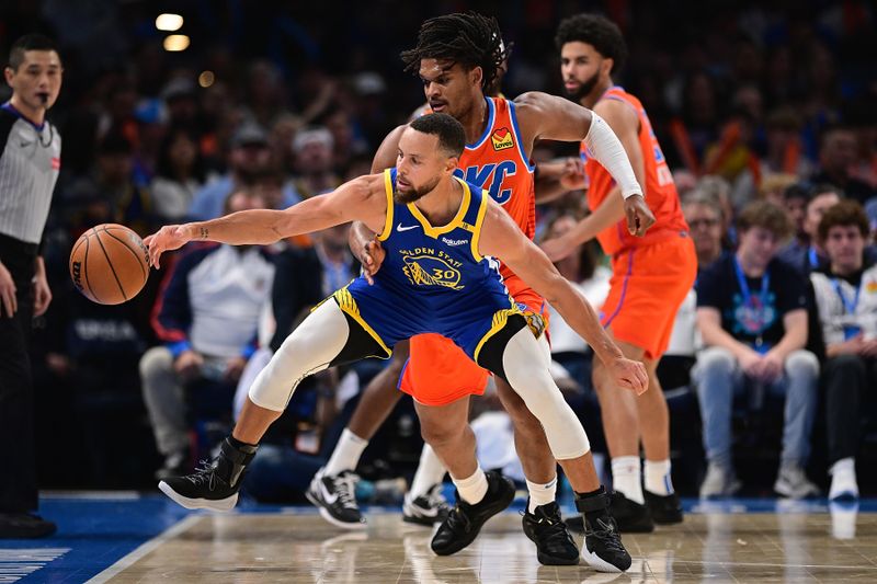 OKLAHOMA CITY, OKLAHOMA - NOVEMBER 10: Stephen Curry #30 of the Golden State Warriors loses the ball while defended by Dillon Jones #3 of the Oklahoma City Thunder during the second half at Paycom Center on November 10, 2024 in Oklahoma City, Oklahoma. NOTE TO USER: User expressly acknowledges and agrees that, by downloading and or using this photograph, User is consenting to the terms and conditions of the Getty Images License Agreement. (Photo by Joshua Gateley/Getty Images)