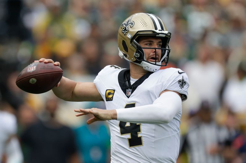 New Orleans Saints quarterback Derek Carr (4) passes during the first half of an NFL football game against the Green Bay Packers Sunday, Sept. 24, 2023, in Green Bay, Wis. (AP Photo/Matt Ludtke)