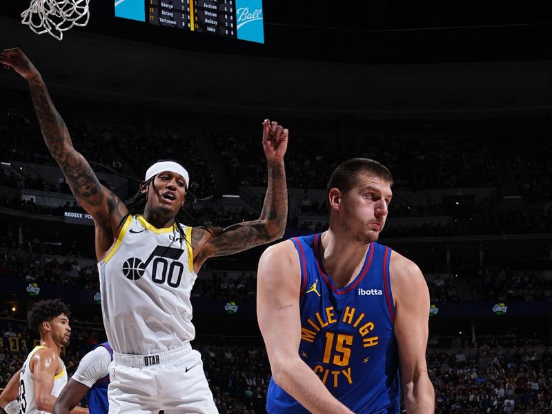 DENVER, CO - MARCH 9: Nikola Jokic #15 of the Denver Nuggets rebounds the ball during the game against the Utah Jazz on March 9, 2024 at the Ball Arena in Denver, Colorado. NOTE TO USER: User expressly acknowledges and agrees that, by downloading and/or using this Photograph, user is consenting to the terms and conditions of the Getty Images License Agreement. Mandatory Copyright Notice: Copyright 2024 NBAE (Photo by Garrett Ellwood/NBAE via Getty Images)