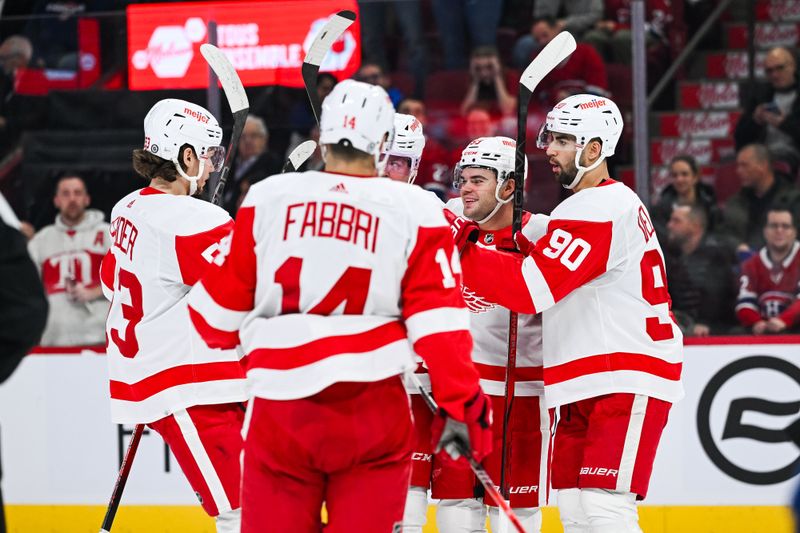 Dec 2, 2023; Montreal, Quebec, CAN; Detroit Red Wings right wing Alex DeBrincat (93) celebrates his goal against the Montreal Canadiens with his teammates during the second period at Bell Centre. Mandatory Credit: David Kirouac-USA TODAY Sports