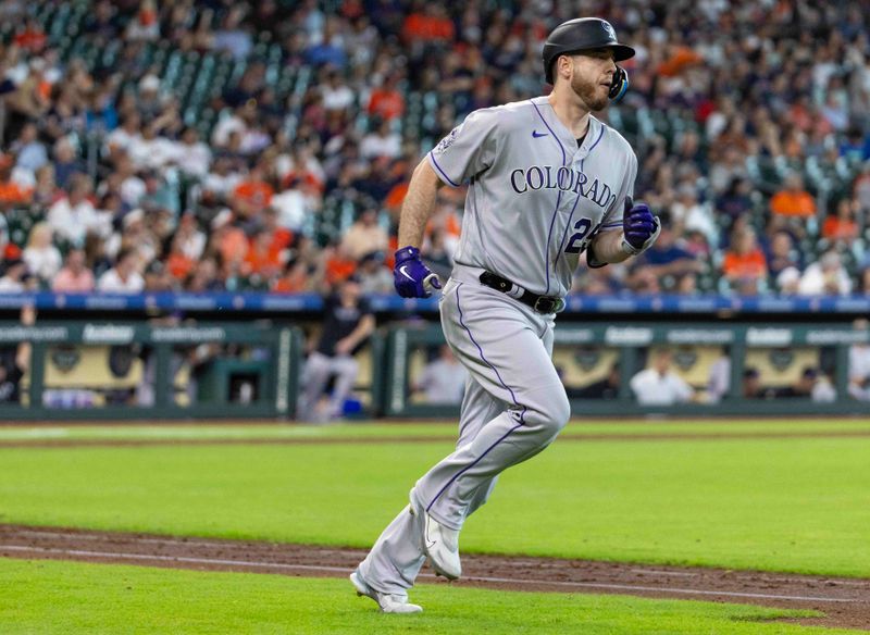 Jul 5, 2023; Houston, Texas, USA; Colorado Rockies designated hitter C.J. Cron (25) rounds the bases after hitting a home run against the Houston Astros in the sixth inning at Minute Maid Park. Mandatory Credit: Thomas Shea-USA TODAY Sports