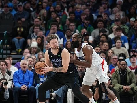 DALLAS, TX - DECEMBER 20: James Harden #1 of the LA Clippers plays defense against Luka Doncic #77 of the Dallas Mavericks during the game on December 20, 2023 at the American Airlines Center in Dallas, Texas. NOTE TO USER: User expressly acknowledges and agrees that, by downloading and or using this photograph, User is consenting to the terms and conditions of the Getty Images License Agreement. Mandatory Copyright Notice: Copyright 2023 NBAE (Photo by Glenn James/NBAE via Getty Images)