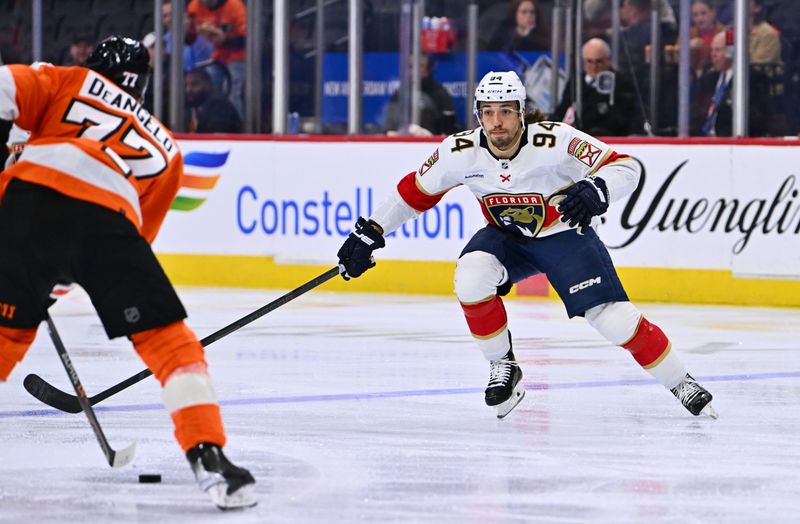 Mar 21, 2023; Philadelphia, Pennsylvania, USA;Florida Panthers left wing Ryan Lomberg (94) defends Philadelphia Flyers defenseman Tony DeAngelo (77), left, in the second period  at Wells Fargo Center. Mandatory Credit: Kyle Ross-USA TODAY Sports