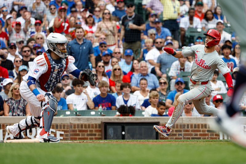 Jul 4, 2024; Chicago, Illinois, USA; Philadelphia Phillies shortstop Trea Turner (7) scores against the Chicago Cubs during the first inning at Wrigley Field. Mandatory Credit: Kamil Krzaczynski-USA TODAY Sports