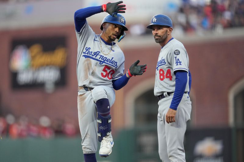 Sep 13, 2025; San Francisco, California, USA; Los Angeles Dodgers shortstop Mookie Betts (50) reacts after hitting a single against the San Francisco Giants in the third inning at Oracle Park. Mandatory Credit: Cary Edmondson-Imagn Images