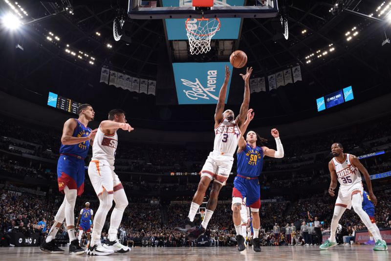 DENVER, CO - MARCH 5: Bradley Beal #3 of the Phoenix Suns rebounds the ball during the game against the Denver Nuggets on March 5, 2024 at the Ball Arena in Denver, Colorado. NOTE TO USER: User expressly acknowledges and agrees that, by downloading and/or using this Photograph, user is consenting to the terms and conditions of the Getty Images License Agreement. Mandatory Copyright Notice: Copyright 2024 NBAE (Photo by Garrett Ellwood/NBAE via Getty Images)