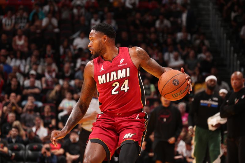 MIAMI, FL - NOVEMBER 26: Haywood Highsmith #24 of the Miami Heat handles the ball during the game against the Milwaukee Bucks during the Emirates NBA Cup game on November 26, 2024 at Kaseya Center in Miami, Florida. NOTE TO USER: User expressly acknowledges and agrees that, by downloading and or using this Photograph, user is consenting to the terms and conditions of the Getty Images License Agreement. Mandatory Copyright Notice: Copyright 2024 NBAE (Photo by Issac Baldizon/NBAE via Getty Images)