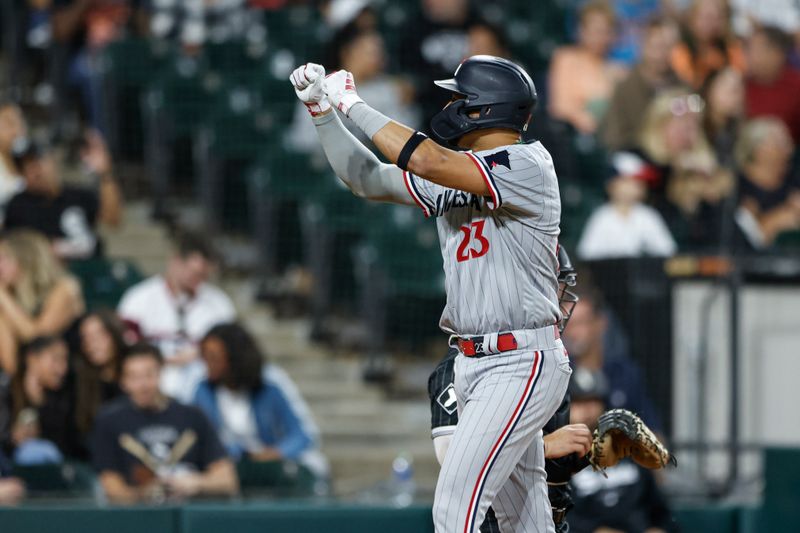 Sep 15, 2023; Chicago, Illinois, USA; Minnesota Twins third baseman Royce Lewis (23) celebrates as he crosses home plate after hitting a grand slam against the Chicago White Sox during the second inning at Guaranteed Rate Field. Mandatory Credit: Kamil Krzaczynski-USA TODAY Sports