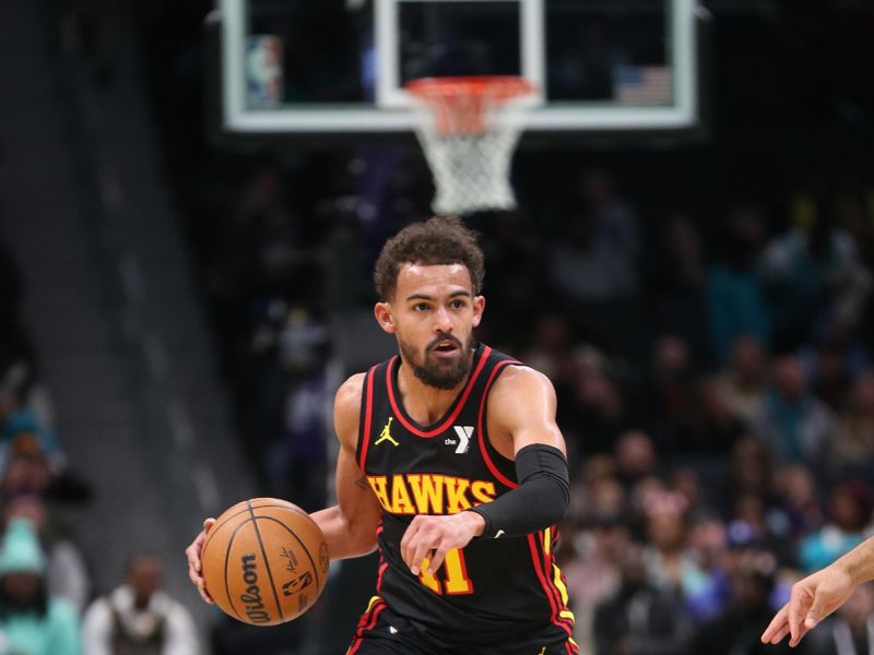 CHARLOTTE, NC - NOVEMBER 30: Trae Young #11 of the Atlanta Hawks handles the ball during the game against the Charlotte Hornets on November 30, 2024 at Spectrum Center in Charlotte, North Carolina. NOTE TO USER: User expressly acknowledges and agrees that, by downloading and or using this photograph, User is consenting to the terms and conditions of the Getty Images License Agreement. Mandatory Copyright Notice: Copyright 2024 NBAE (Photo by Brock Williams-Smith/NBAE via Getty Images)