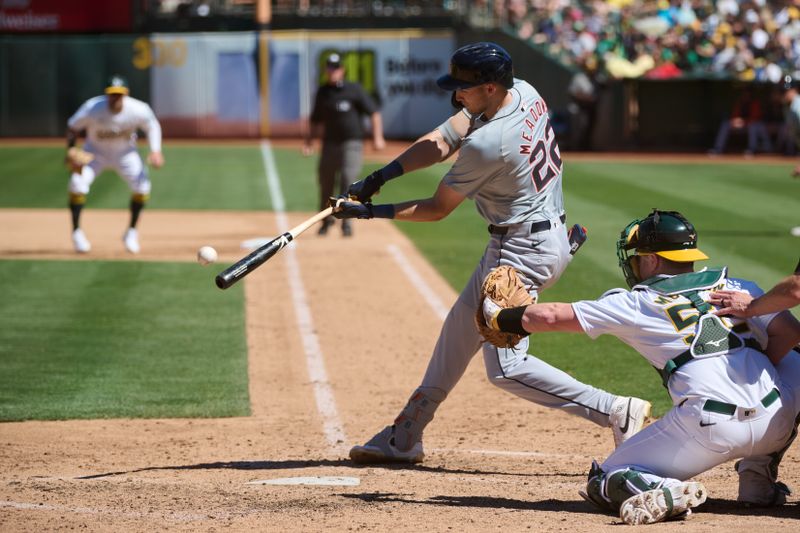 Sep 7, 2024; Oakland, California, USA; Detroit Tigers outfielder Parker Meadows (22) hits an RBI sacrifice fly against the Oakland Athletics during the seventh inning at Oakland-Alameda County Coliseum. Mandatory Credit: Robert Edwards-Imagn Images