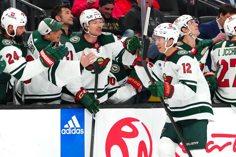 Feb 12, 2024; Las Vegas, Nevada, USA; Minnesota Wild left wing Matt Boldy (12) celebrates after scoring a goal against the Vegas Golden Knights during the third period at T-Mobile Arena. Mandatory Credit: Stephen R. Sylvanie-USA TODAY Sports