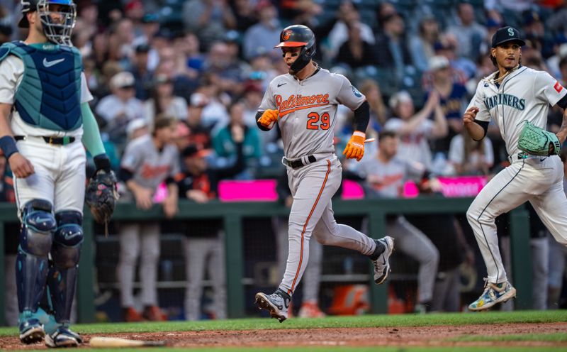 Jun 4, 2025; Seattle, Washington, USA;  Balitimore Orioles third basemanRamon Urias (29) scores a run during the seventh inning against the Seattle Mariners at T-Mobile Park. Mandatory Credit: Stephen Brashear-Imagn Images