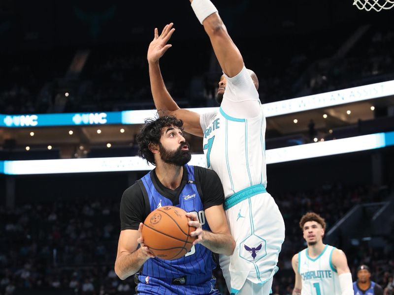 CHARLOTTE, NC -NOVEMBER 25:  Goga Bitadze #35 of the Orlando Magic handles the ball during the game against the Charlotte Hornets on November 25, 2024 at Spectrum Center in Charlotte, North Carolina. NOTE TO USER: User expressly acknowledges and agrees that, by downloading and or using this photograph, User is consenting to the terms and conditions of the Getty Images License Agreement. Mandatory Copyright Notice: Copyright 2024 NBAE (Photo by Brock Williams-Smith/NBAE via Getty Images)