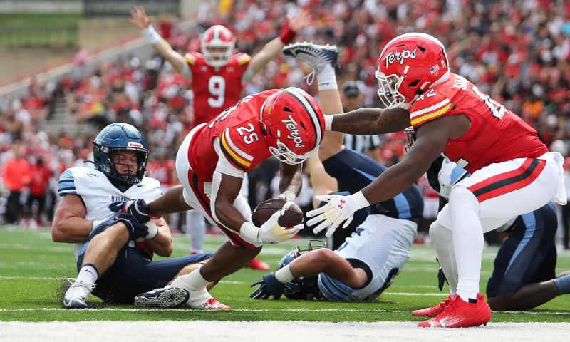 Sep 21, 2024; College Park, Maryland, USA; Maryland Terrapins running back Nolan Ray (25) scores a touchdown against the Villanova Wildcats during the second quarter at SECU Stadium. Mandatory Credit: Daniel Kucin Jr.-Imagn Images

