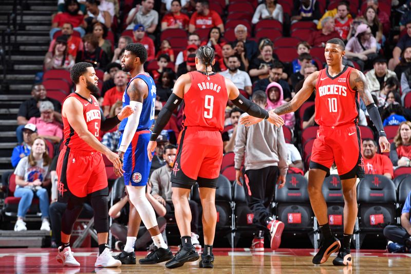 HOUSTON, TX - MARCH 6: Dillon Brooks #9 of the Houston Rockets high fives Jabari Smith Jr. #10 during the game against the LA Clippers on March 6, 2024 at the Toyota Center in Houston, Texas. NOTE TO USER: User expressly acknowledges and agrees that, by downloading and or using this photograph, User is consenting to the terms and conditions of the Getty Images License Agreement. Mandatory Copyright Notice: Copyright 2024 NBAE (Photo by Logan Riely/NBAE via Getty Images)