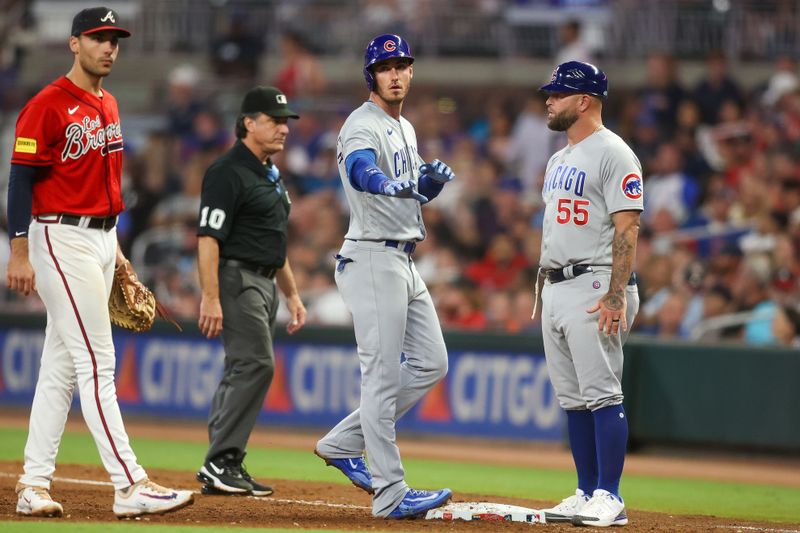 Sep 28, 2023; Atlanta, Georgia, USA; Chicago Cubs first baseman Cody Bellinger (24) reacts after a single against the Atlanta Braves in the eighth inning at Truist Park. Mandatory Credit: Brett Davis-USA TODAY Sports