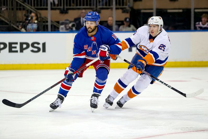 Sep 24, 2024; New York, New York, USA; New York Rangers center Vincent Trocheck (16) and New York Islanders defenseman Dennis Cholowski (25) battle for position during the first period at Madison Square Garden. Mandatory Credit: Danny Wild-Imagn Images