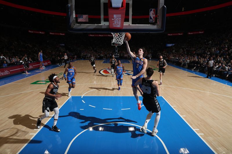 OKLAHOMA CITY, OK - APRIL 10:  Josh Giddey #3 of the Oklahoma City Thunder drives to the basket during the game against the San Antonio Spurs on April 10, 2024 at Paycom Arena in Oklahoma City, Oklahoma. NOTE TO USER: User expressly acknowledges and agrees that, by downloading and or using this photograph, User is consenting to the terms and conditions of the Getty Images License Agreement. Mandatory Copyright Notice: Copyright 2024 NBAE (Photo by Zach Beeker/NBAE via Getty Images)