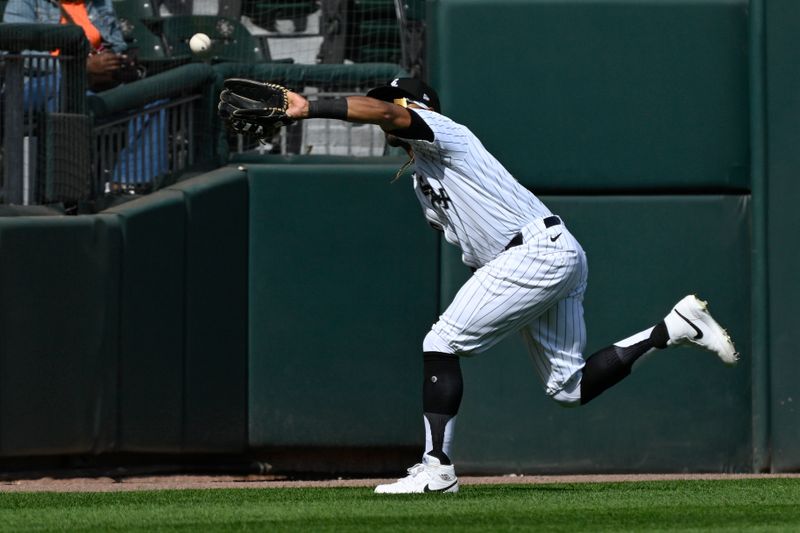 Jun 27, 2024; Chicago, Illinois, USA; Chicago White Sox outfielder Corey Julks (30) catches a fly ball hit by Atlanta Braves outfielder Forrest Wall (not pictured) during the seventh inning at Guaranteed Rate Field. Mandatory Credit: Matt Marton-USA TODAY Sports