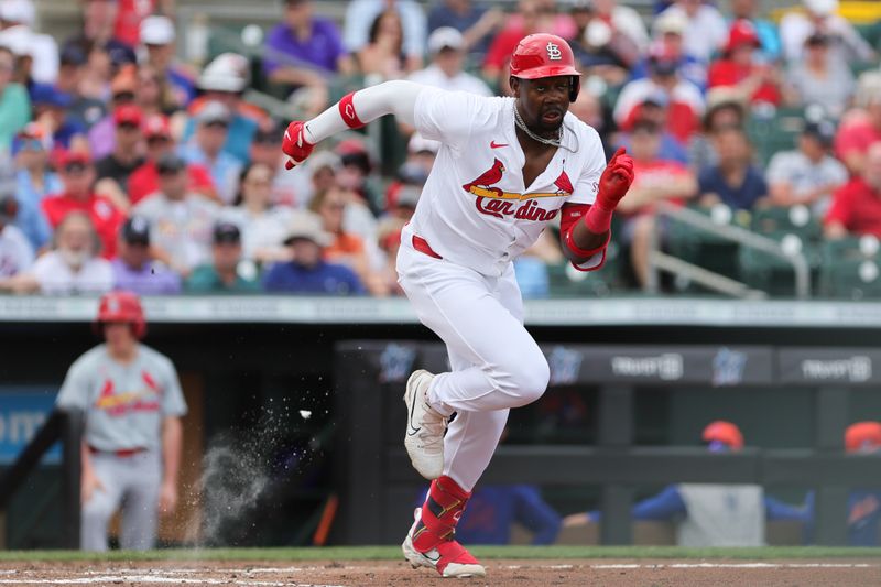 Mar 1, 2024; Jupiter, Florida, USA; St. Louis Cardinals right fielder Jordan Walker (18) runs toward first base after a wild pitch during the third inning at Roger Dean Chevrolet Stadium. Mandatory Credit: Sam Navarro-USA TODAY Sports