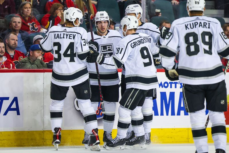 Mar 28, 2023; Calgary, Alberta, CAN; Los Angeles Kings defenseman Sean Durzi (50) celebrates his goal with teammates against the Calgary Flames during the first period at Scotiabank Saddledome. Mandatory Credit: Sergei Belski-USA TODAY Sports