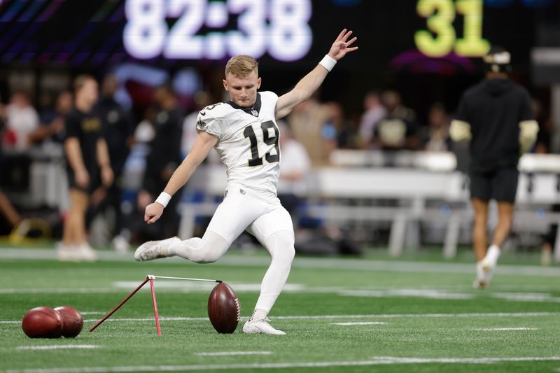 New Orleans Saints kicker Blake Grupe (19) warms up prior to an NFL football game against the Atlanta Falcons, Sunday, Sept. 29, 2024, in Atlanta. (AP Photo/Stew Milne)