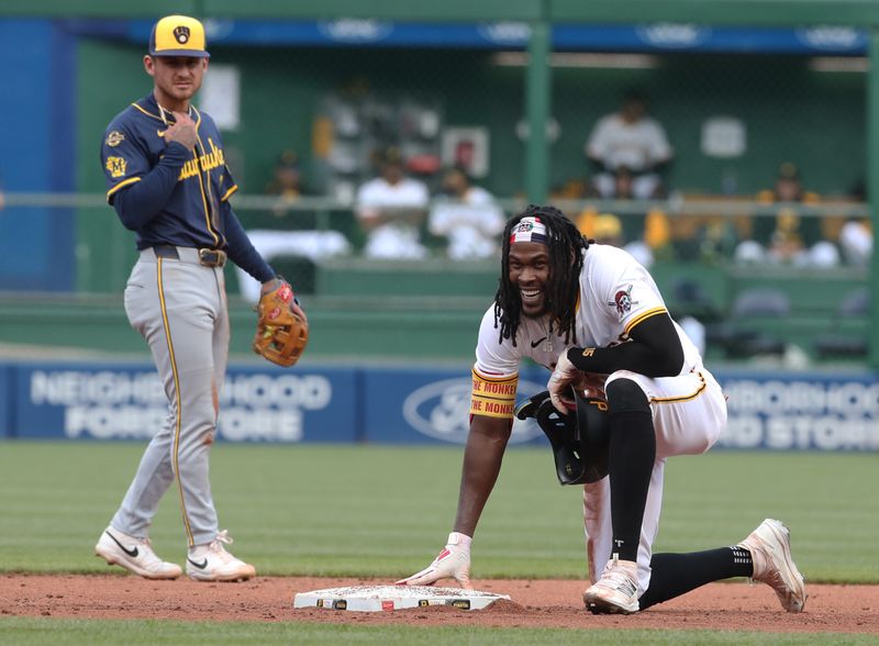 May 24, 2025; Pittsburgh, Pennsylvania, USA;  Pittsburgh Pirates center fielder Oneil Cruz (15) reacts at second base as Milwaukee Brewers shortstop Joey Ortiz (left) looks on during the fifth inning at PNC Park. Mandatory Credit: Charles LeClaire-Imagn Images