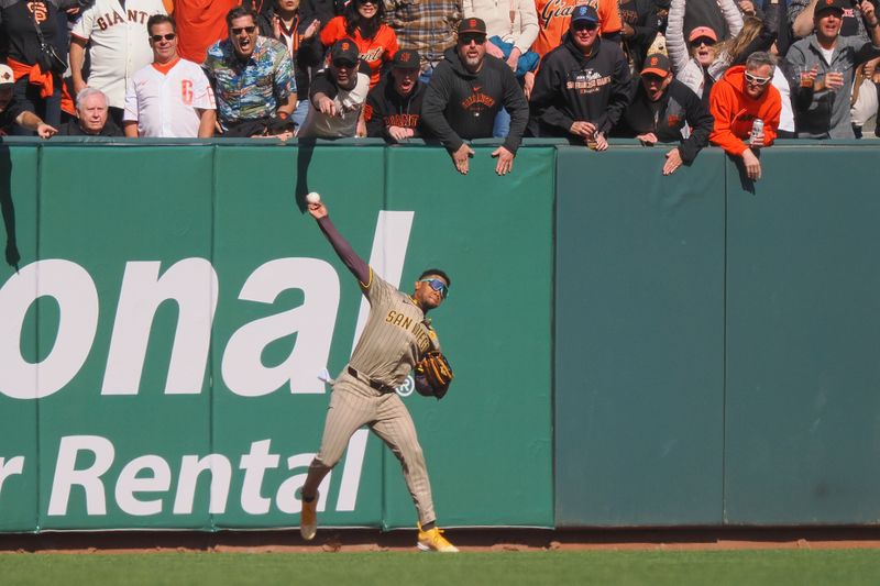 Apr 5, 2024; San Francisco, California, USA; San Diego Padres left fielder Jose Azocar (28) throws the ball infield against the San Francisco Giants during the ninth inning at Oracle Park. Mandatory Credit: Kelley L Cox-USA TODAY Sports