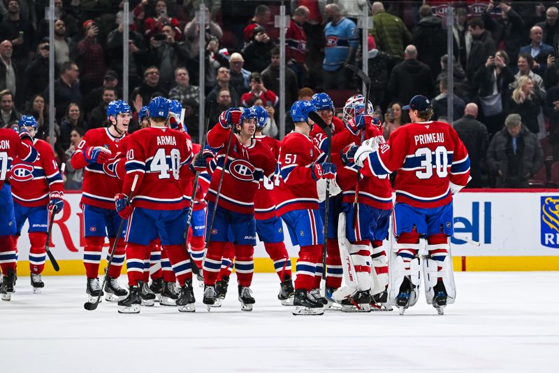 Dec 3, 2024; Montreal, Quebec, CAN; Montreal Canadiens players gather to celebrate their win against the New York Islanders at Bell Centre. Mandatory Credit: David Kirouac-Imagn Images