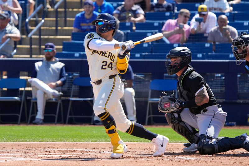 Mar 13, 2024; Phoenix, Arizona, USA; Milwaukee Brewers William Contreras (24) hits against the Chicago White Sox in the first inning at American Family Fields of Phoenix. Mandatory Credit: Rick Scuteri-USA TODAY Sports