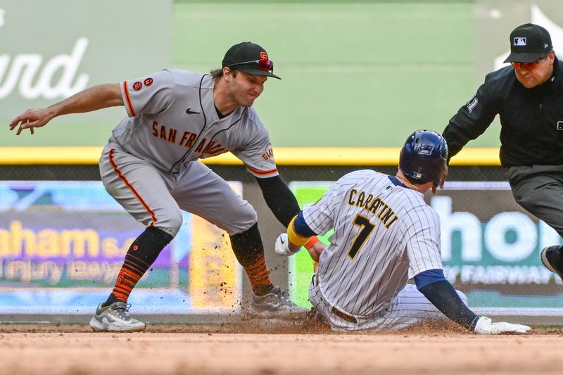 May 27, 2023; Milwaukee, Wisconsin, USA; San Francisco Giants shortstop Casey Schmitt (6) tags out Milwaukee Brewers catcher Victor Caratini (7) while trying to get to second base in the seventh inning at American Family Field. Mandatory Credit: Benny Sieu-USA TODAY Sports