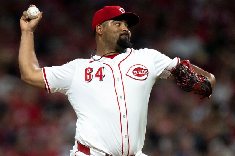 Aug 3, 2024; Cincinnati, Ohio, USA; Cincinnati Reds pitcher Tony Santillan (64) throws against the San Francisco Giants in the eighth inning at Great American Ball Park. Mandatory Credit: Albert Cesare-USA TODAY Sports